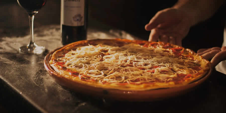pizza wine red lighting display food photography