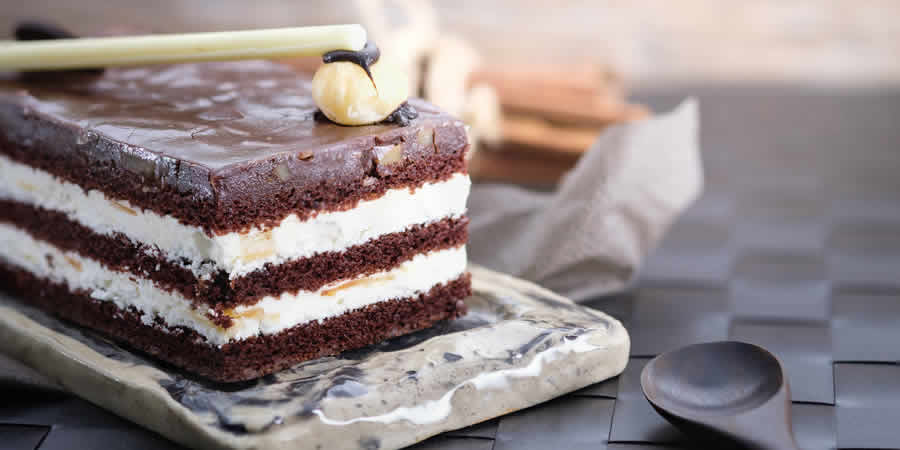 chocolate cake slice plate wooden spoon display food photography