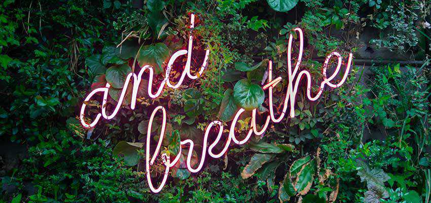 A sign that reads "And Breathe".